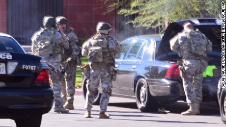 A swat team arrives at the scene of a shooting in San Bernardino, Calif. on Wednesday,  Dec. 2, 2015.  Police responded to reports of an active shooter at a social services facility. (Doug Saunders/Los Angeles News Group via AP) MANDATORY CREDIT