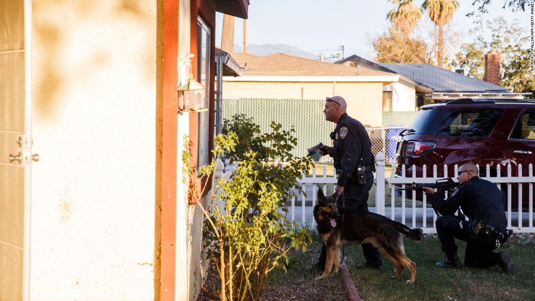 Police search for the suspects in San Bernardino.