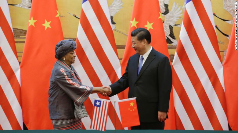 China&#39;s President Xi Jinping shakes hands with Liberia&#39;s President Ellen Johnson-Sirleaf in Beijing in November, 2015. The meeting was aimed at promoting bilateral relations.