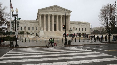 People wait inline to enter the US Supreme Court November 10, 2015 in Washington, DC. 