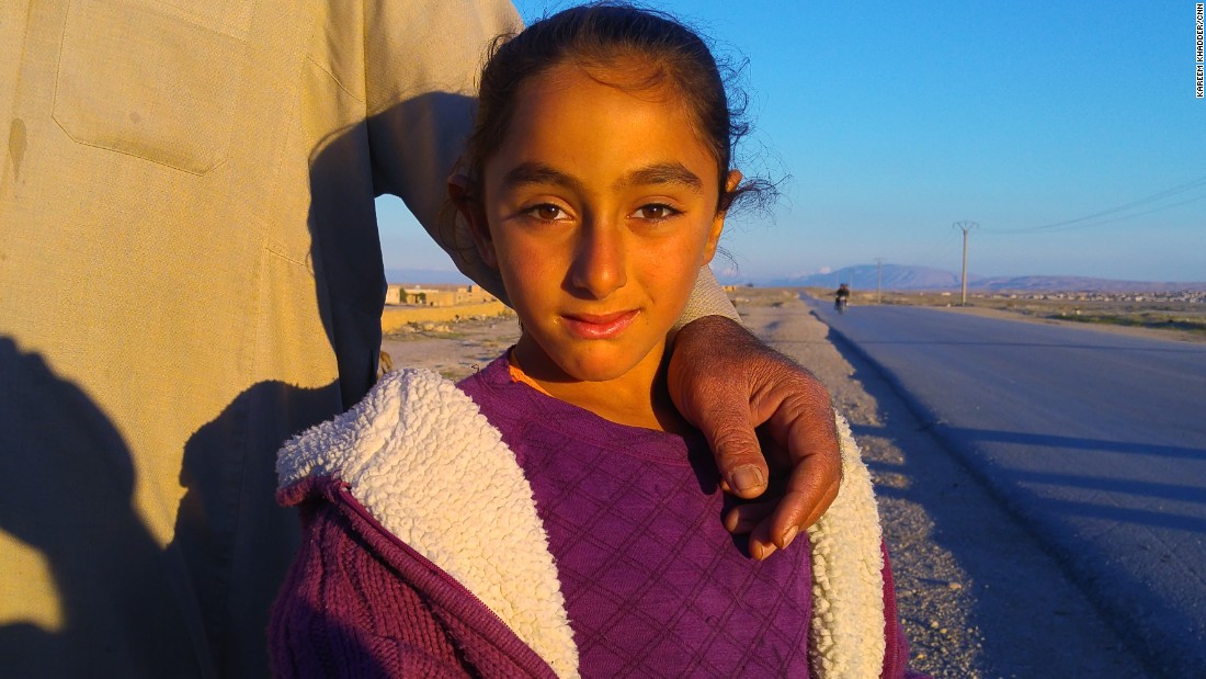 A young resident of Al-Houl, whose extended family of 40 is hoping to return home. They&#39;re staying in other abandoned homes a few kilometers away. Kurdish officials say most of the residents of Al-Houl fled with ISIS.