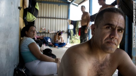 Cubans from a group of 150 rest in a shelter in the town of La Cruz , Guanacaste, Costa Rica, near the border with Nicaragua on November 17, 2015. A surge of some 2,000 Cuban migrants trying to cross Central America to reach the United States triggered a diplomatic spat between Costa Rica and Nicaragua Monday, plunging tense relations between the two countries to a new low. AFP PHOTO / Ezequiel BECERRA        (Photo credit should read EZEQUIEL BECERRA/AFP/Getty Images)