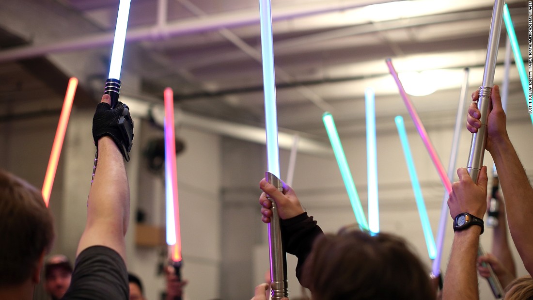 Students hold up their lightsabers during a Golden Gate Knights class in saber choreography in San Francisco, California. 