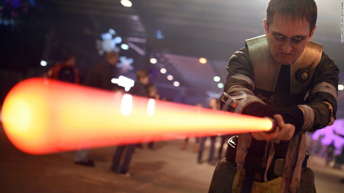 A performer dressed as the Star Wars character Galen Marek, brandishes a lightsaber during the unofficial Star Wars convention, &#39;For the Love of the Force,&#39; in Manchester, northern England on December 4, 2015. 