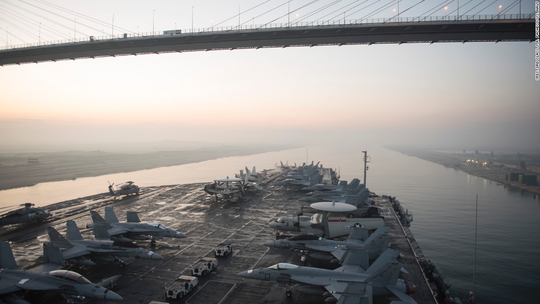 The aircraft carrier USS Harry S. Truman (CVN 75) passes under the Friendship Bridge while transiting the Suez Canal on Dec. 14, 2015. The ship is conducting operations in the Persian Gulf, where Iran claims to have taken footage of the carrier using a drone. Click through the gallery for more images of U.S. Navy aircraft carriers.