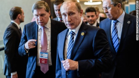 Russian President Vladimir Putin (C) arrives on day two of the G20 Turkey Leaders Summit on November 16, 2015 in Antalya. Putin said on November 16 that the attacks in Paris showed the need for his proposal for an international anti-terror coalition to be realised. 