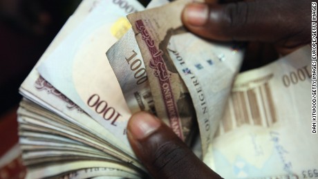  Nigerian naira being counted  in an exchange office in Lagos, Nigeria. 