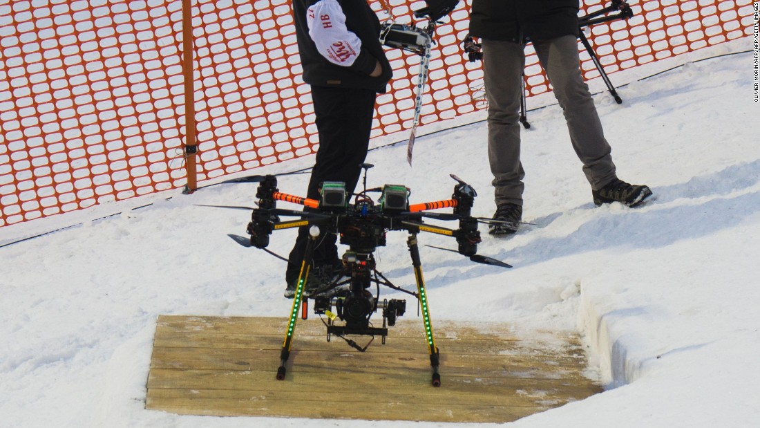 The drone fitted with a camera -- shown here prior to its crash -- landed just inches behind him at the top of the slope.&lt;br /&gt;