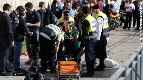 The body of the Palestinian assailant who was shot dead following the attack lies on a sidewalk.
