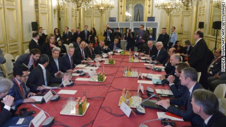 U.S. Secretary of State John Kerry meets with French Foreign Minister Laurent Fabius (4th R) and other leaders--all male-- at the start of the ministerial meeting on Syria in Paris in December.
