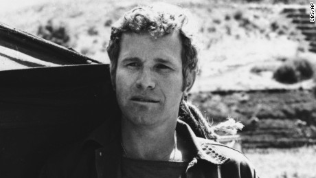 In this photo provided by CBS, Wayne Rogers poses for a photo in his character of Trapper John McIntyre from the television series &quot;M*A*S*H,&quot; in an undated photo. Rogers has died. The actor was surrounded by family when he died Thursday, Dec. 31 in Los Angeles of complications from pneumonia at age 82, his publicist and longtime friend Rona Menashe told The Associated Press. 