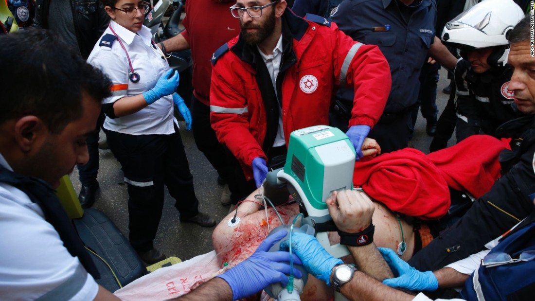 Medics give emergency treatment to a victim.