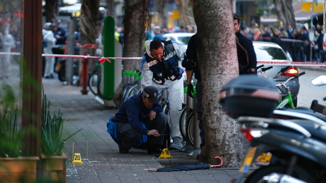 Forensic experts inspect the scene.