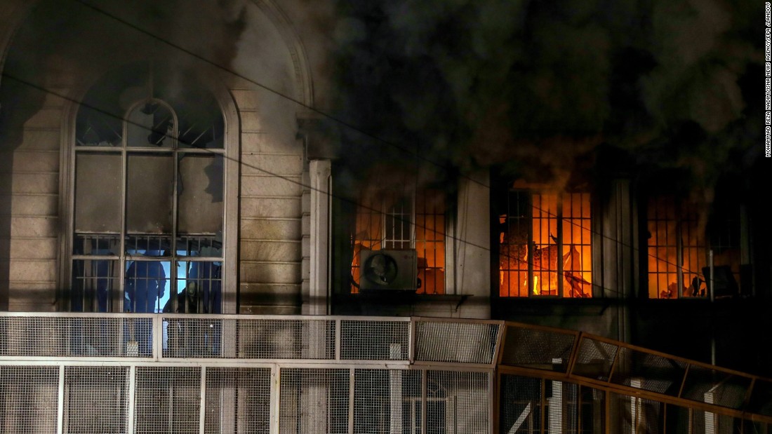 Smoke billows from the windows of the burning Saudi Embassy on January 2. A CNN producer in Tehran said some protesters made it inside the building, setting fire and ransacking some records.