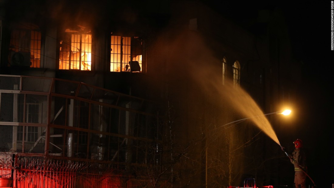 A firefighter sprays water on the flames on January 2 in Tehran, Iran, a Shiite-majority nation, issued a statement deploring the execution and warning that Saudi Arabia would pay a heavy price for its policies.