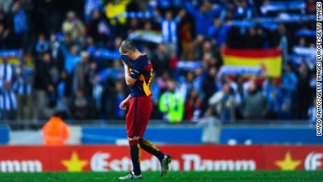 Barcelona playmaker Andres Iniesta leaves the pitch dejected at the end of Saturday&#39;s match with Espanyol.