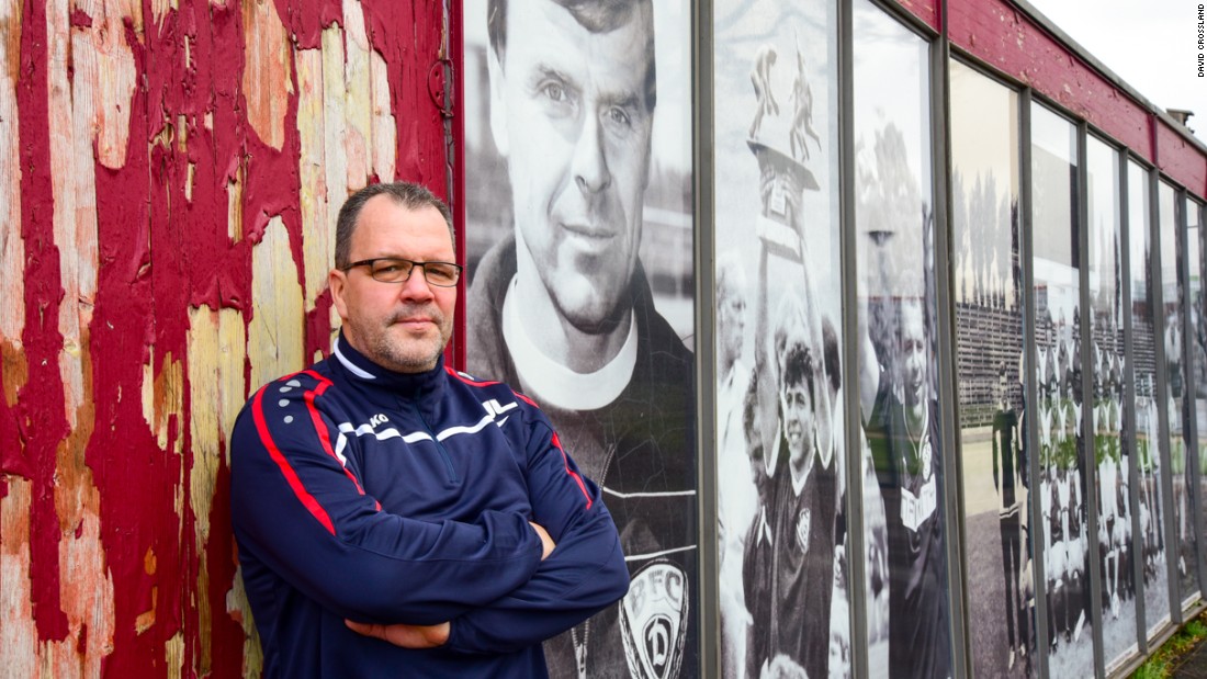 BFC manager Jörn Lenz, 46, a former midfielder for the club, stands next to photos of the team&#39;s past successes. BFC won East Germany&#39;s Oberliga for 10 successive years between 1979 and 1988.