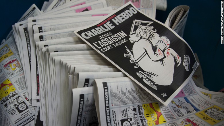 Charlie Hebdo comes out fighting after painful year 