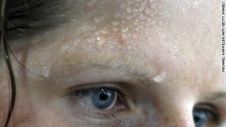 Sweat is seen on the forehead of German rowing athlete Christine Huth at the Gym at the Athlete&#39;s Olympic Village in Beijing on August 5, 2008.