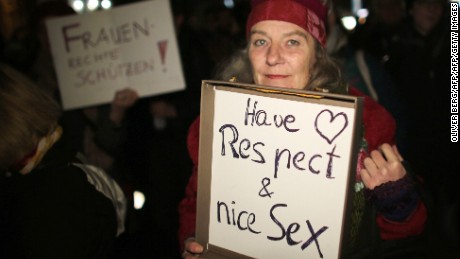 A woman holds a sign during a demonstration in Cologne after a wave of attacks on women over New Year&#39;s Eve.