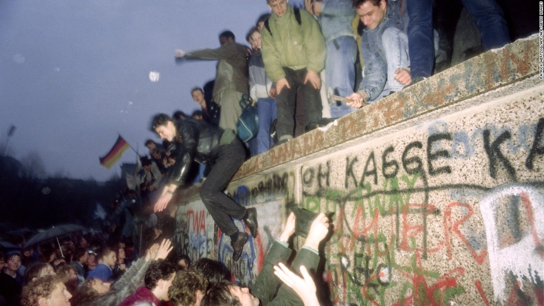 People from East Germany greet citizens of West Germany at the Brandenburg Gate in Berlin on December 22, 1989 as the border was opened. Bundesliga clubs rapidly lured away BFC&#39;s best players.