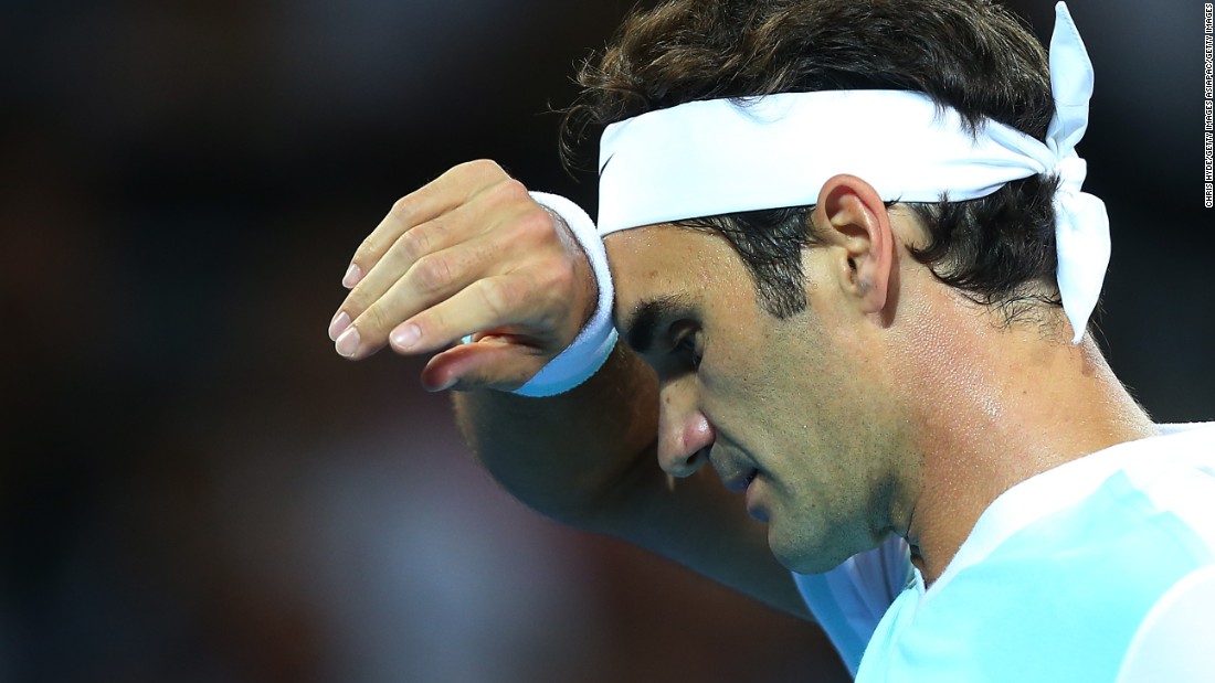 A weary Roger Federer slips to defeat against Milos Raonic of Canada in the final of the Brisbane International tournament.