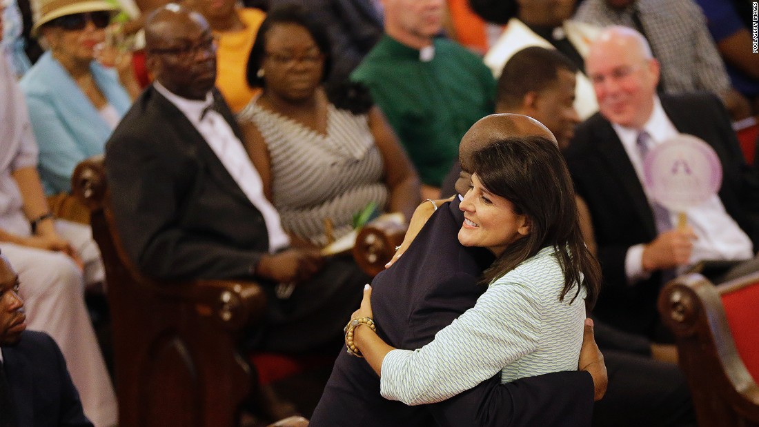 Haley embraces U.S. Sen. Tim Scott of South Carolina at the Emanuel A.M.E. Church on June 21, 2015, four days after a mass shooting that claimed the lives of nine people at the historic church in Charleston.