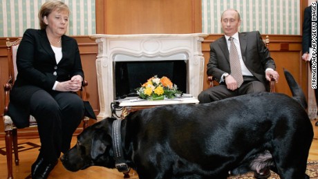 Germany&#39;s Angela Merkel watches uneasily as Russian President Vladimir Putin&#39;s dog approaches in 2007.