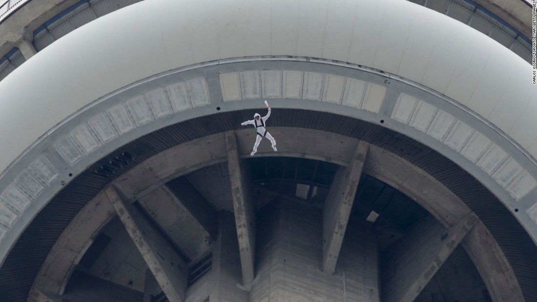 BASE jumper Fred Fugen, from Red Bull&#39;s Soul Flyers team, leaps from Toronto&#39;s 1,815-foot &lt;a href=&quot;http://www.cnn.com/2013/10/03/world/cn-tower-fast-facts/&quot;&gt;CN Tower &lt;/a&gt;in May.