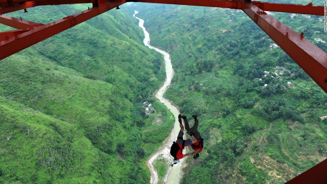 A BASE jumper descends from the Baling River Bridge in Anshun, China, in July 2012. That&#39;s when China held its first-ever BASE jumping event from the suspension bridge, which is considered one of the highest in the world.