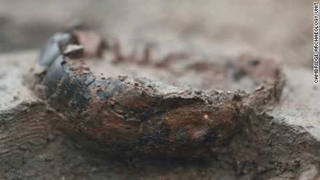 Close up of charred wooden bucket base.