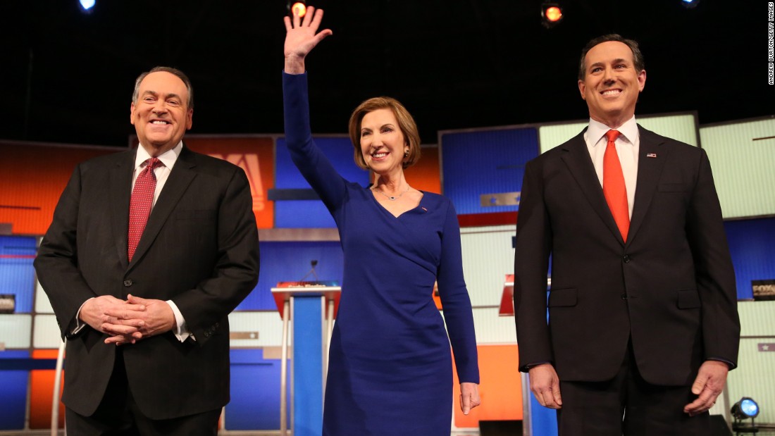 From left, Republican presidential candidates Mike Huckabee, Carly Fiorina and Rick Santorum arrive for the &quot;undercard&quot; debate that took place a couple of hours before the main event.