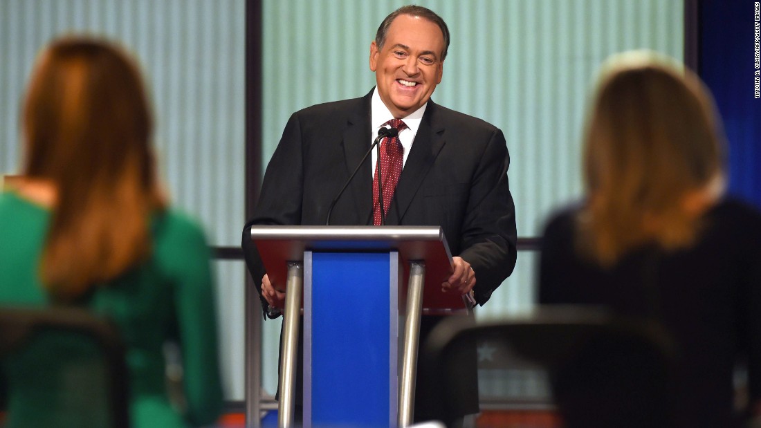 Huckabee laughs during the debate, which was hosted by the Fox Business Network. His opening statement was much more serious. &quot;There are a lot of people who are hurting today,&quot; said the former Arkansas governor. &quot;I wish the President knew more of them. He might make a change in the economy and the way he&#39;s managing it.&quot;