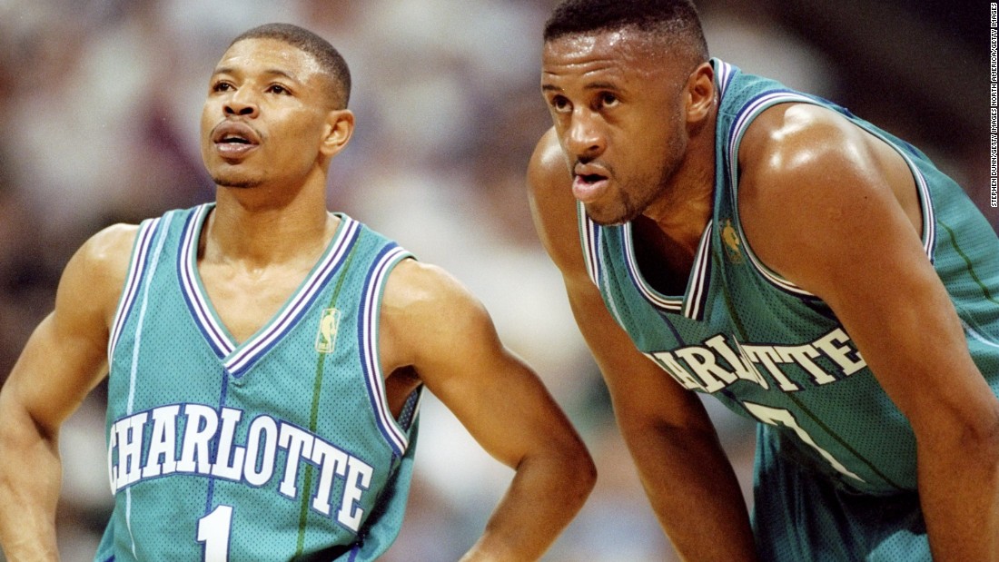 At 5 feet 3 inches tall, Tyrone &quot;Muggsy&quot; Bogues is the smallest player in NBA history. Here, 6-feet-7-inch forward Rafael Addison stoops to Muggsy&#39;s level during a game against the Dallas Mavericks in Texas in 1997. 