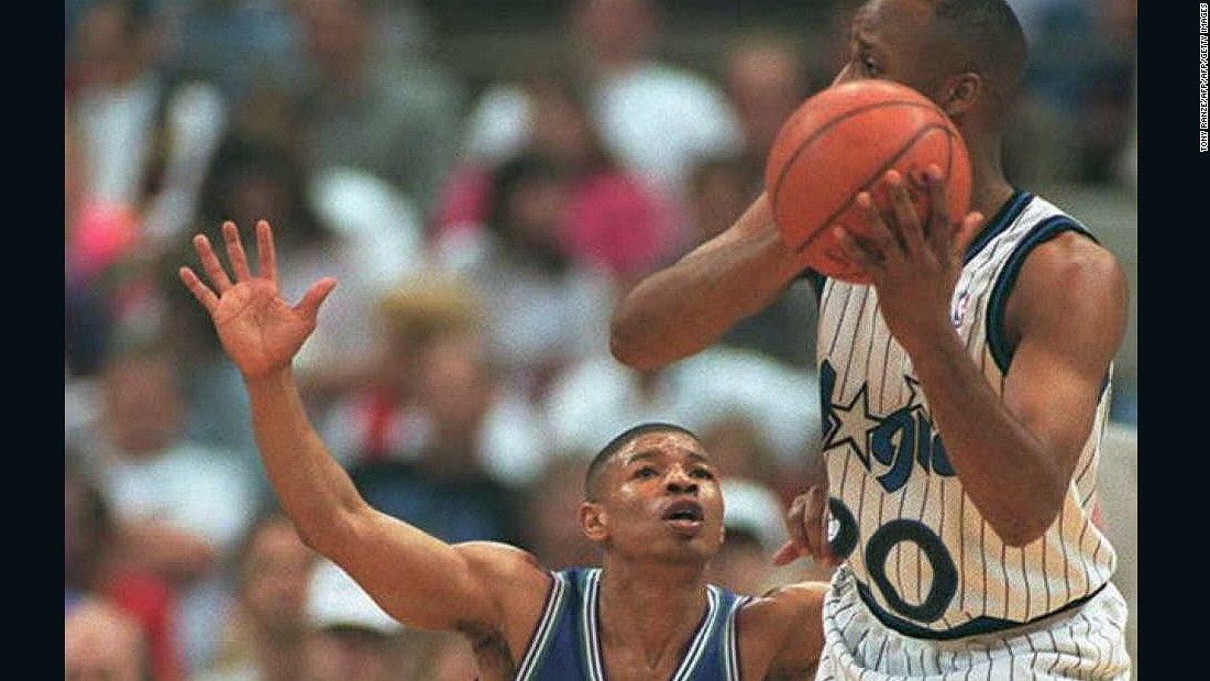 &quot;Down here!&quot; Bogues tries in vain to oppose guard Brian Shaw of the Orlando Magic.