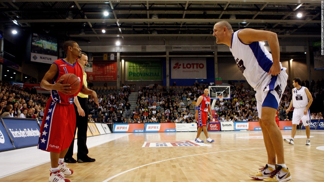 David meets Goliath: Muggsy holds the ball during an exhibition game between the &quot;USA Legends of Basketball&quot; and a Germany/Luxemburg All Star team in 2009. Bogues was greeted with incredulity wherever he went. Today, he&#39;s remembered as a legend. 