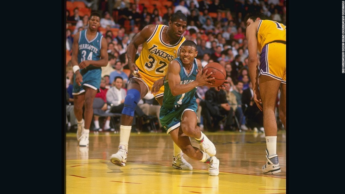 Bogues in action for the Hornets against LA Lakers legend Magic Johnson during the 1990-91 NBA season.