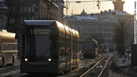A tram passes through central Helsinki.