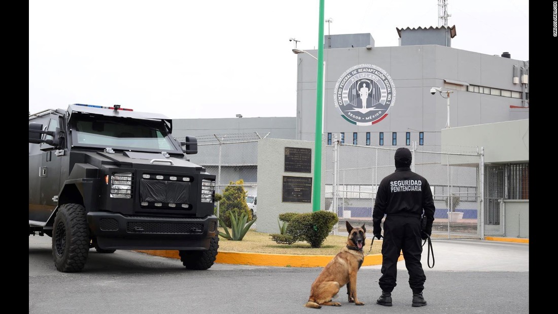 Military vehicles and canine officers guard the Altiplano prison.