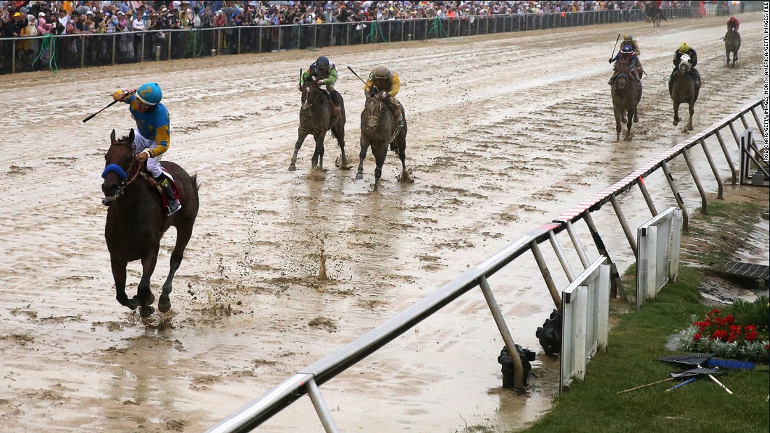 MAY 16 2015: In a mud bath of a track, Espinoza lifts his arm in victory at the Preakness Stakes in Baltimore -- part two of the three races that make up America&#39;s Triple Crown. 