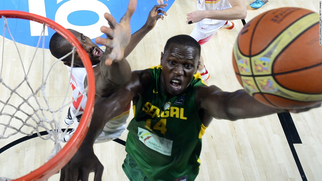 Senegal&#39;s center Gorgui Dieng -- seen dunking on Spain&#39;s forward Serge Ibaka (who was born in the Republic of the Congo) during the 2014 FIBA World basketball championships round of 16 match Spain vs. Senegal -- starred for Louisville in college and currently plays for the Minnesota Timberwolves of the NBA. 