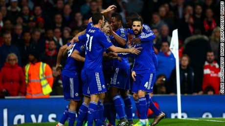 Diego Costa is mobbed by teammates after scoring the only goal of the game in the 1-0 win for Chelsea over Arsenal at the Emirates.