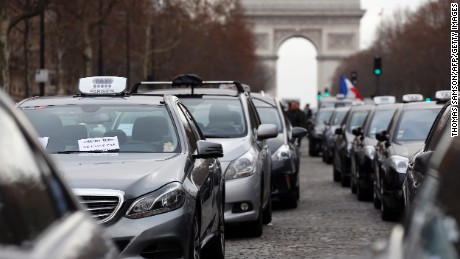 Taxi drivers protest  Tuesday in Paris against competition from Uber-like companies.