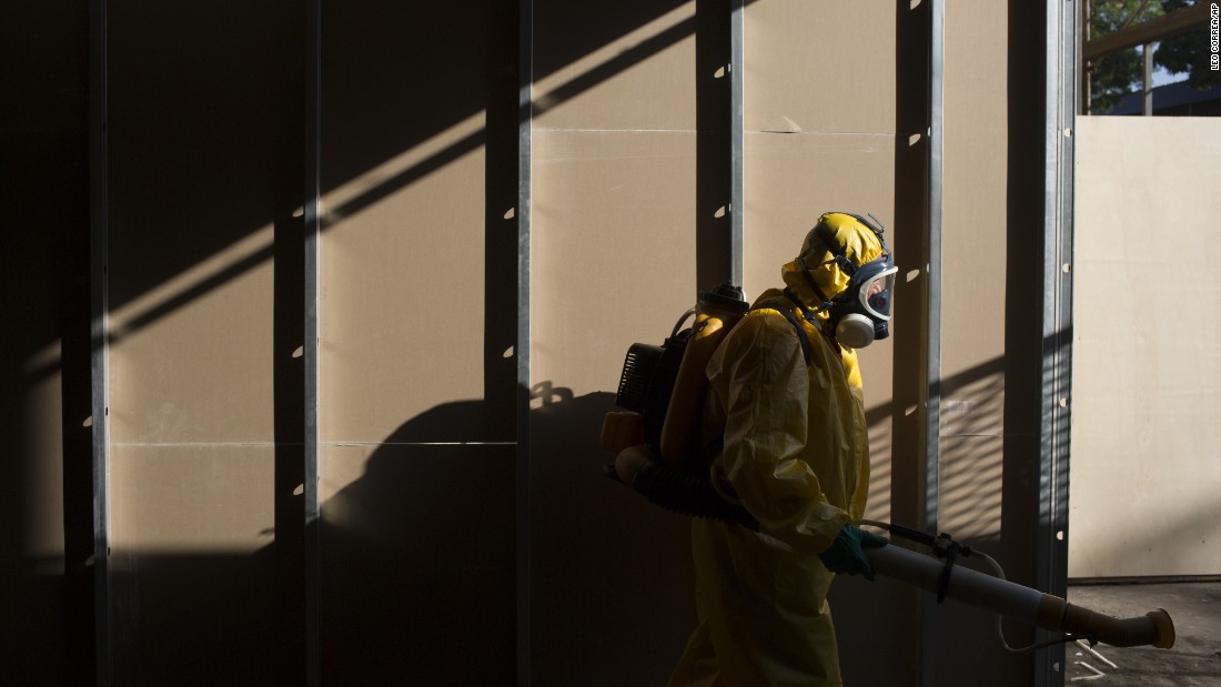 A health worker sprays insecticide under the bleachers of Rio de Janeiro&#39;s Sambadrome on Tuesday, January 26.