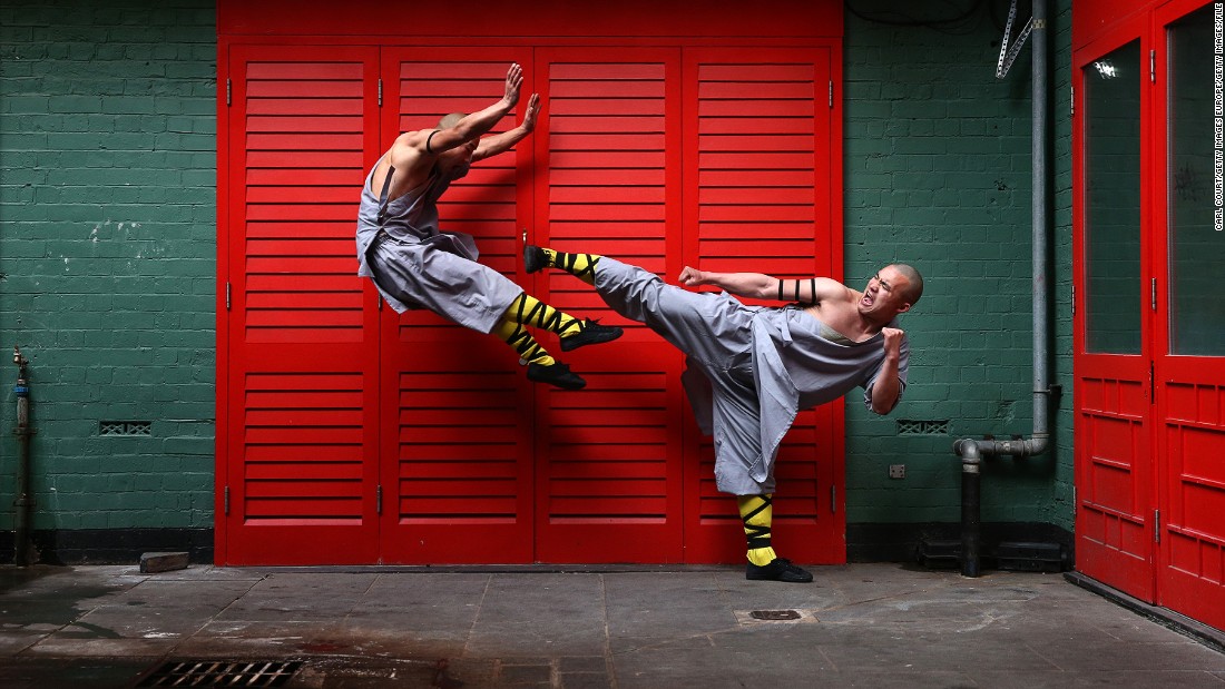 Shaolin monks pose for a photo in London&#39;s Chinatown. Drewell attempts to emulate their athleticism in his routine but admits it&#39;s hard. &quot;I try to do a kind of high kick while they are fighting,&quot; he says. &quot;I tried to do it on the horse but my feet don&#39;t go so high -- but I try!&quot;&lt;br /&gt;