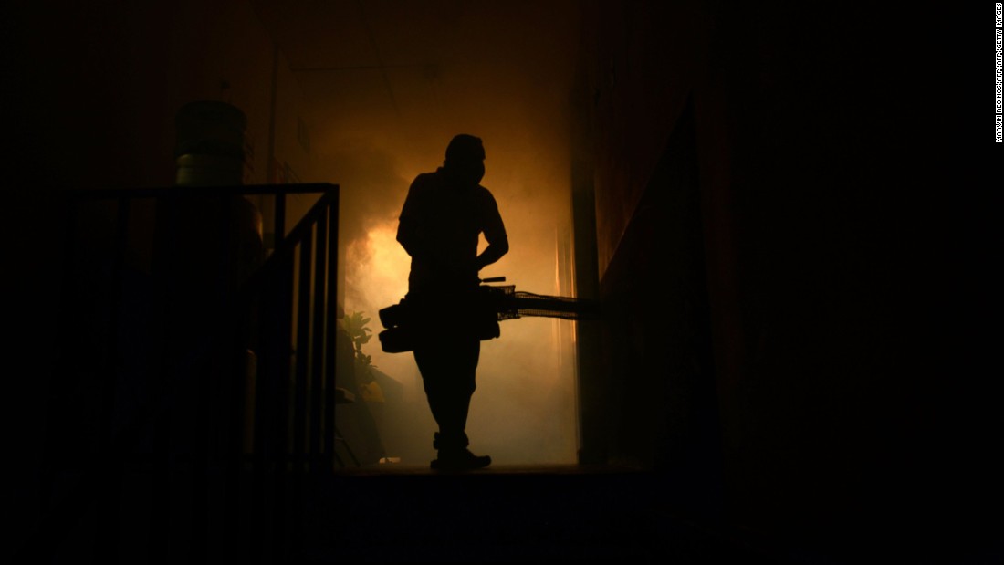 A health ministry employee fumigates a home in Soyapango, El Salvador, on January 27.