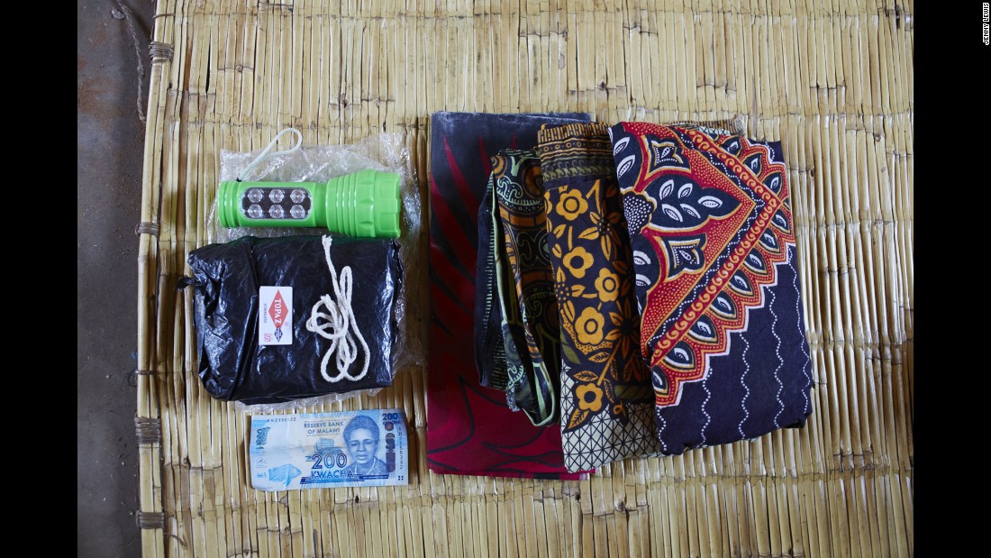 Ellen Phiri&#39;s bag includes: a flashlight because there is no electricity, a black plastic sheet to cover the delivery bed because it is it hard to clean the area, a razor blade to cut the umbilical cord, string to tie the umbilical cord, 200 Malawian Kwacha for food, three large sarongs for the mother to wear and to wrap her baby in.