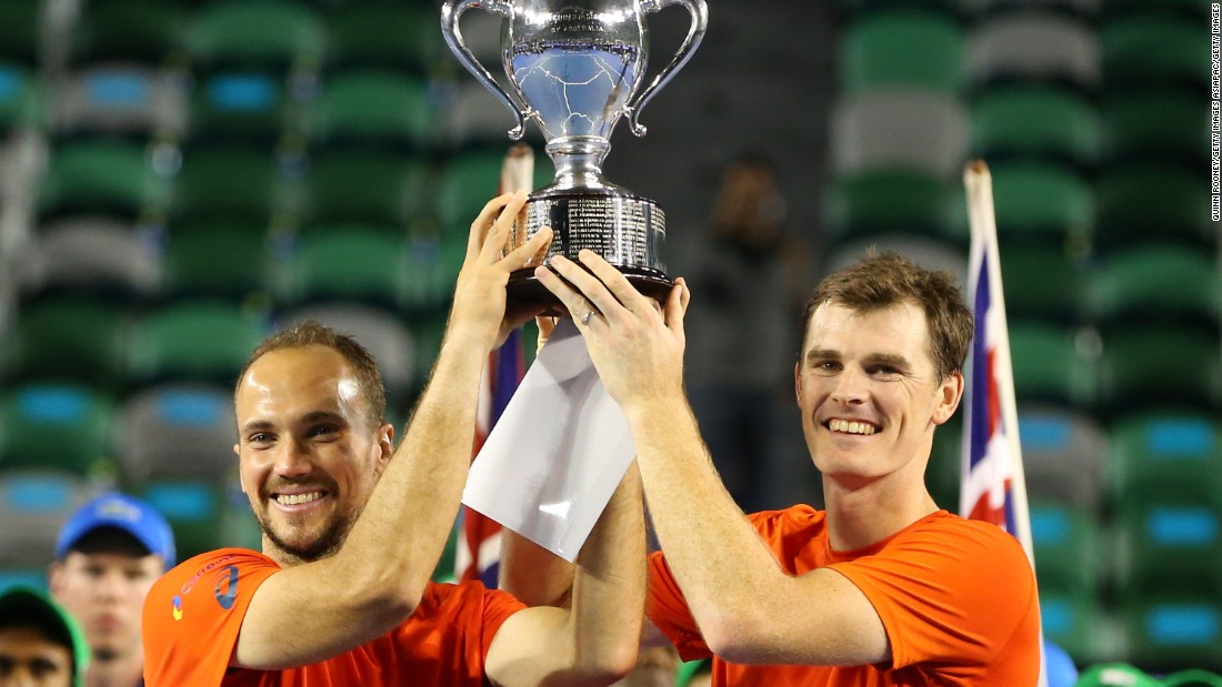 Jamie Murray of Britain (right) and Bruno Soares of Brazil lift the men&#39;s doubles trophy after beating Daniel Nestor of Canada and Radek Stepanek of Czech Republic in the final.