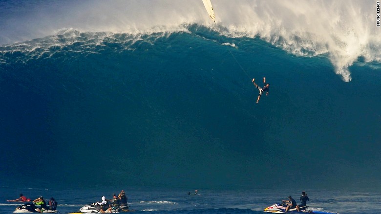 See 40-foot wave swallow surfer