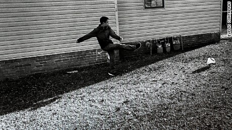 Jesús plays soccer after school while his parents rest during an afternoon break before returning to work.